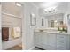 Bright bathroom featuring granite counters and a shower with glass doors at 394 Teal Ct, Roswell, GA 30076