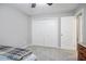 Bright bedroom featuring a closet with bifold doors and a ceiling fan at 394 Teal Ct, Roswell, GA 30076