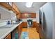 Functional kitchen with stainless steel appliances and wooden cabinetry at 394 Teal Ct, Roswell, GA 30076