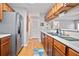 Functional kitchen with stainless steel appliances and wooden cabinetry at 394 Teal Ct, Roswell, GA 30076