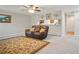 Comfortable living area with a plush sofa and an open view to the kitchen at 394 Teal Ct, Roswell, GA 30076