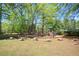 Community playground with benches and play structures set on a well-maintained lawn at 394 Teal Ct, Roswell, GA 30076