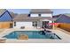 Aerial view of a backyard oasis, showcasing a large swimming pool with a waterfall feature at 4152 Woodward Mill Rd, Sugar Hill, GA 30518