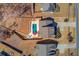 Aerial shot of home and backyard featuring a pool, fire pit, patio, and fenced yard at 4152 Woodward Mill Rd, Sugar Hill, GA 30518