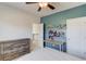 Comfortable bedroom featuring a ceiling fan, furniture, and natural light at 4152 Woodward Mill Rd, Sugar Hill, GA 30518