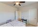 Bedroom featuring light pink bedding, a white desk, and reading nook at 4152 Woodward Mill Rd, Sugar Hill, GA 30518