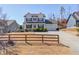 Charming two-story home featuring black shutters, an attached two-car garage and a well-manicured lawn at 4152 Woodward Mill Rd, Sugar Hill, GA 30518