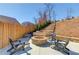 Stone fire pit with chairs on a backyard patio, with steps going up a landscaped hill at 4152 Woodward Mill Rd, Sugar Hill, GA 30518