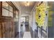 Inviting foyer with hardwood floors, a barn door, and a view into the living room, creating a warm and welcoming atmosphere at 4152 Woodward Mill Rd, Sugar Hill, GA 30518