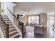 Living room with hardwood floors, cozy fireplace, ceiling fan and lots of natural light at 4152 Woodward Mill Rd, Sugar Hill, GA 30518