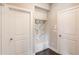Functional mudroom with built-in storage, hooks, bench, and access to interior and exterior doors at 4152 Woodward Mill Rd, Sugar Hill, GA 30518