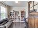 Cozy office space with hardwood floors, built-in bookshelves, and comfortable seating, creating a functional and stylish workspace at 4152 Woodward Mill Rd, Sugar Hill, GA 30518