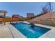A luxurious pool with a waterfall feature complemented by professionally designed landscaping at 4152 Woodward Mill Rd, Sugar Hill, GA 30518