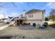 Expansive backyard featuring a covered patio, outdoor grill, and lush green lawn at 2325 Woodcrest Se Dr, Smyrna, GA 30082