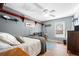 Cozy bedroom with grey walls, wood floors, and an organized closet system, perfect for relaxation and storage at 2325 Woodcrest Se Dr, Smyrna, GA 30082