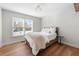 Neutral bedroom with hardwood floors and a large window bringing in natural light at 2325 Woodcrest Se Dr, Smyrna, GA 30082