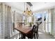 Dining area featuring large windows, stylish curtains, and an industrial-style light fixture at 2325 Woodcrest Se Dr, Smyrna, GA 30082