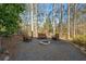 Enjoy the outdoors around the firepit with ample seating for relaxation at 2325 Woodcrest Se Dr, Smyrna, GA 30082