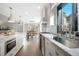 Beautiful kitchen with stainless appliances, white cabinets, tiled backsplash, and a center island at 2325 Woodcrest Se Dr, Smyrna, GA 30082