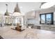 Bright, updated kitchen with large center island, stainless steel appliances, and modern pendant lighting at 2325 Woodcrest Se Dr, Smyrna, GA 30082