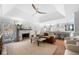 Bright living room with fireplace, hardwood floors, and a view to the kitchen and outdoor deck at 2325 Woodcrest Se Dr, Smyrna, GA 30082