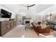 Cozy living room with a fireplace, hardwood floors, and access to an outdoor deck or patio at 2325 Woodcrest Se Dr, Smyrna, GA 30082