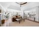 Open-concept living room with a vaulted ceiling, hardwood floors, and a view to the kitchen and dining area at 2325 Woodcrest Se Dr, Smyrna, GA 30082