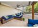 Relaxing covered patio boasts a large seating area, ceiling fan and brick flooring at 2325 Woodcrest Se Dr, Smyrna, GA 30082