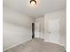 This bedroom has neutral walls, carpet, and a light fixture at 2783 Bayrose Cir # 83, Atlanta, GA 30344