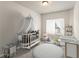 Cozy Bedroom with white crib, area rug, and a bright, airy atmosphere at 2783 Bayrose Cir # 83, Atlanta, GA 30344