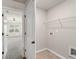 Entryway to the laundry room with metal shelving at 2783 Bayrose Cir # 83, Atlanta, GA 30344