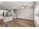 Open floor plan featuring wood floors, staircase, kitchen, and large windows at 2783 Bayrose Cir # 83, Atlanta, GA 30344