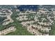 Aerial view showcases the neighborhood's layout, houses, green landscape and nearby lake at 3113 Brians Creek Se Dr, Conyers, GA 30013