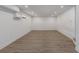 Finished basement area showcasing recessed lighting, vinyl flooring and a mini-split air conditioner at 61 Newcastle Sw St, Atlanta, GA 30314
