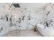 Luxurious bathroom features a rainfall shower, soaking tub, and modern marble tiling at 61 Newcastle Sw St, Atlanta, GA 30314