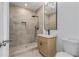 Bathroom features a stylish vanity, walk-in shower with a rainfall shower head, and modern fixtures at 61 Newcastle Sw St, Atlanta, GA 30314