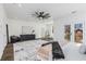 Bright and airy bedroom featuring a private balcony, stylish ceiling fan, and ample closet space at 61 Newcastle Sw St, Atlanta, GA 30314