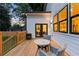 Enjoy outdoor dining on this wood deck with comfortable seating and views of the private backyard at 61 Newcastle Sw St, Atlanta, GA 30314