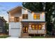 Charming two-story home featuring a covered porch and a second-story balcony for added outdoor enjoyment at 61 Newcastle Sw St, Atlanta, GA 30314