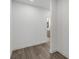 Hallway leading to a bathroom featuring tile flooring and neutral wall colors at 61 Newcastle Sw St, Atlanta, GA 30314