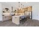 Open concept kitchen with a large island, quartz countertops, stainless steel appliances, and light wood cabinets at 61 Newcastle Sw St, Atlanta, GA 30314