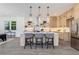 Modern kitchen features stainless steel appliances, island with seating, and open shelving at 61 Newcastle Sw St, Atlanta, GA 30314