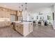 Open layout showcasing kitchen with island, stainless appliances, adjacent dining area and living space; great for entertaining at 61 Newcastle Sw St, Atlanta, GA 30314