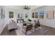 Sun-filled living room with hardwood floors, neutral décor, and large windows at 61 Newcastle Sw St, Atlanta, GA 30314