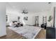 Spacious main bedroom boasts hardwood floors, a ceiling fan, and ample closet space at 61 Newcastle Sw St, Atlanta, GA 30314