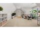 Large bonus room with natural light and seating provides flexible living space at 6880 Nantucket Cv, Cumming, GA 30041