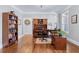 Classic home office featuring hardwood floors, custom bookshelves, and ample workspace at 6880 Nantucket Cv, Cumming, GA 30041