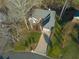 An aerial view of a beautifully landscaped home with a spacious front yard and a two-car garage at 1190 Saint Ives Ct, Suwanee, GA 30024