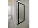 Modern bathroom boasts sleek tile floors, a glass shower, and abundant natural light at 1190 Saint Ives Ct, Suwanee, GA 30024