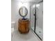 Charming bathroom with a dark stone sink, unique wood cabinet, and a glass-enclosed shower at 1190 Saint Ives Ct, Suwanee, GA 30024